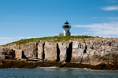 Pond Island Lighthouse Above Rocky Cliffs in Maine